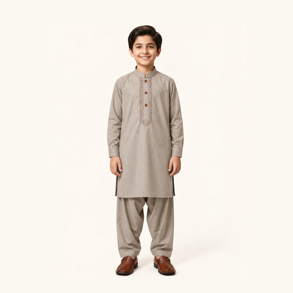 Stone Grey boys’ kurta shalwar with blue-and-gold accents around the embroidered neckline and matching shalwar