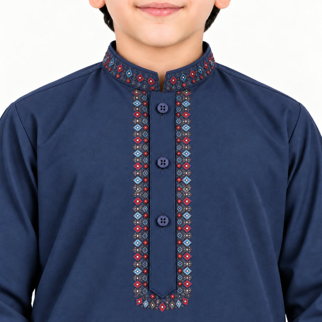 Close-up of multicolour embroidery framing the navy blue boys’ kurta neckline