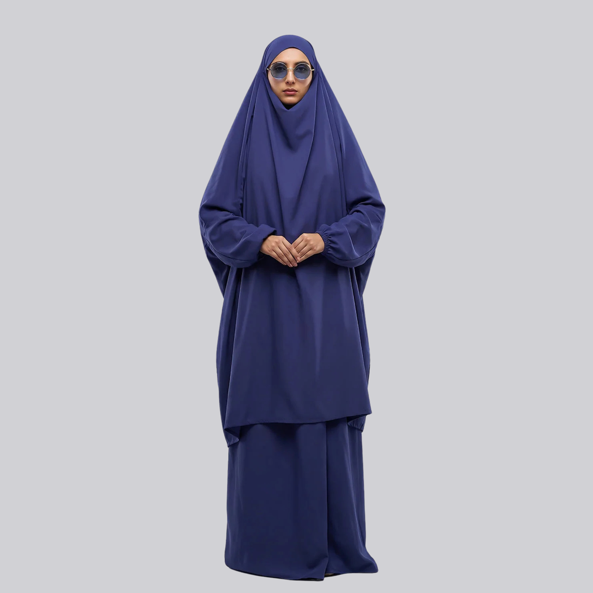 Women’s navy blue two-piece jilbab with a draped top and long skirt