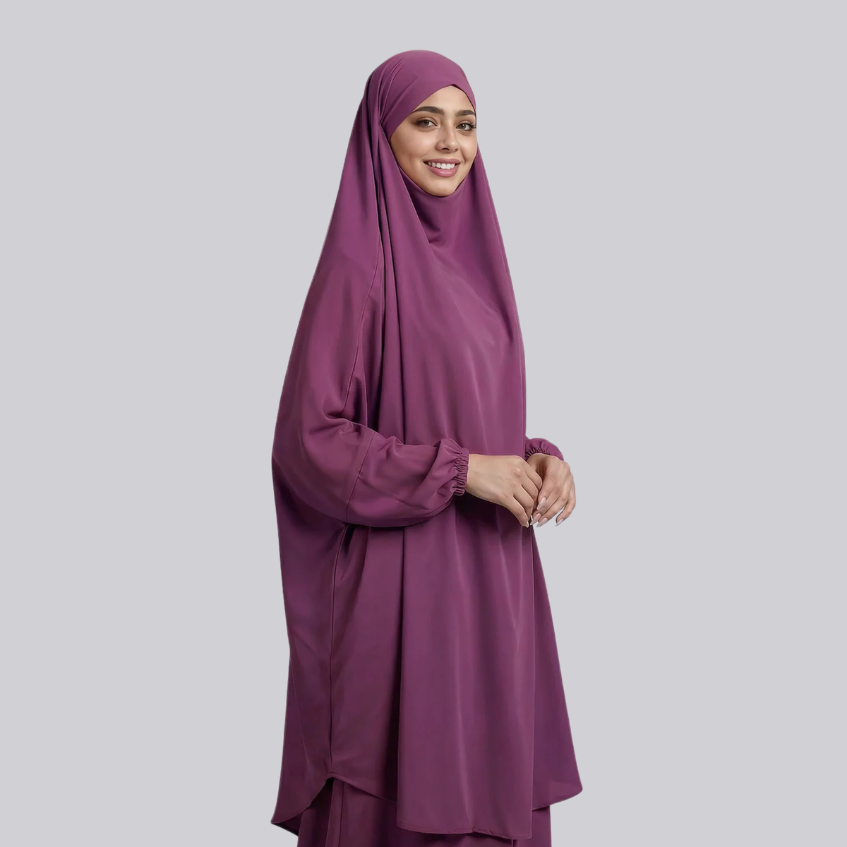 Front view of the plum purple jilbab showing its draped head covering and gathered sleeves