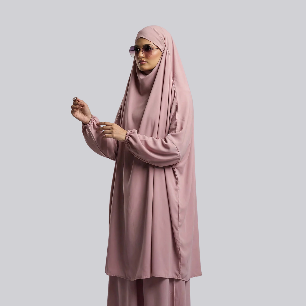 Front view of the light pink jilbab showing the head covering and gathered sleeves