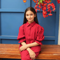 Teen girls’ red co-ord set featuring a collared button-front shirt with gathered puff sleeves and matching trousers