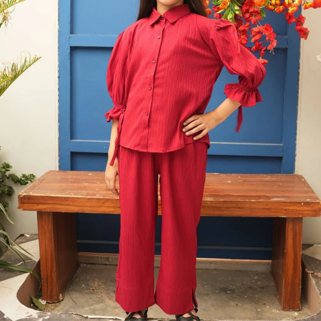 Front view of the red teen girls’ co-ord set with button-front shirt, puff sleeves and matching trousers