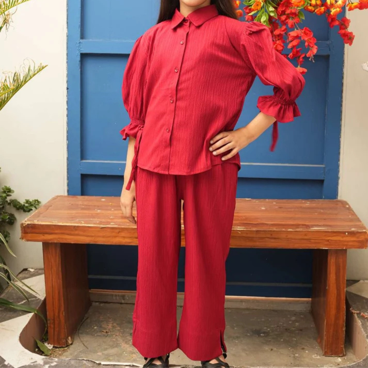 Front view of the red teen girls’ co-ord set with button-front shirt, puff sleeves and matching trousers