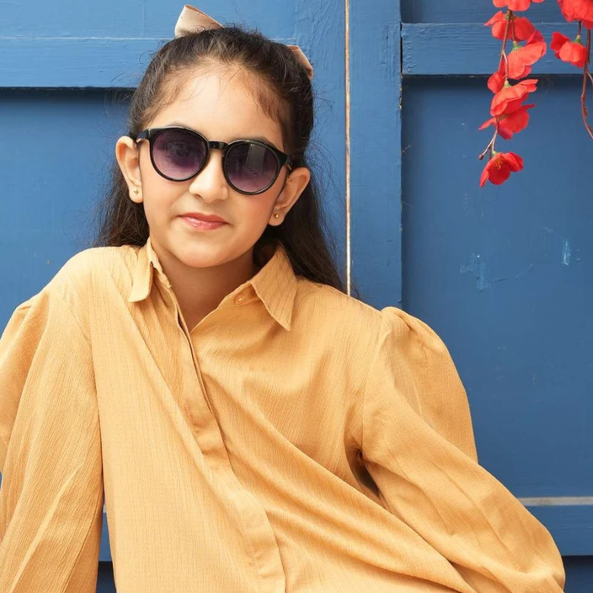 Teen girls’ sandy yellow co-ord set featuring a loose collared shirt with a button front and matching trousers