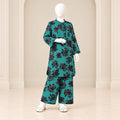 Girls’ ferozi two-piece suit with dark floral motifs across a turquoise-coloured base, a long-sleeved top and matching trousers