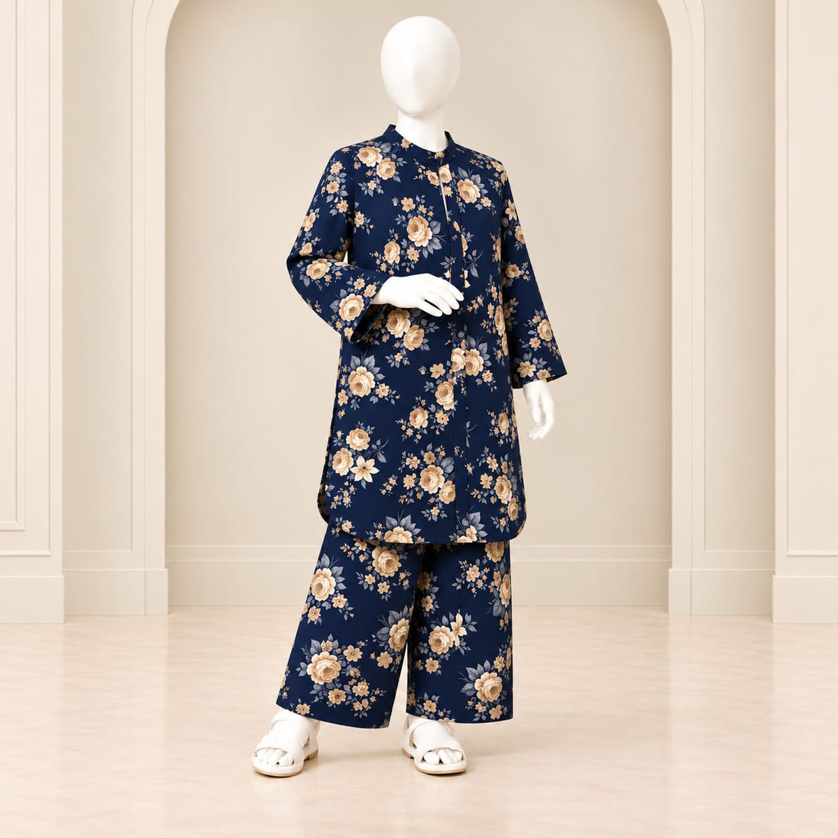 Navy blue girls’ floral shirt and matching trousers displayed on a mannequin
