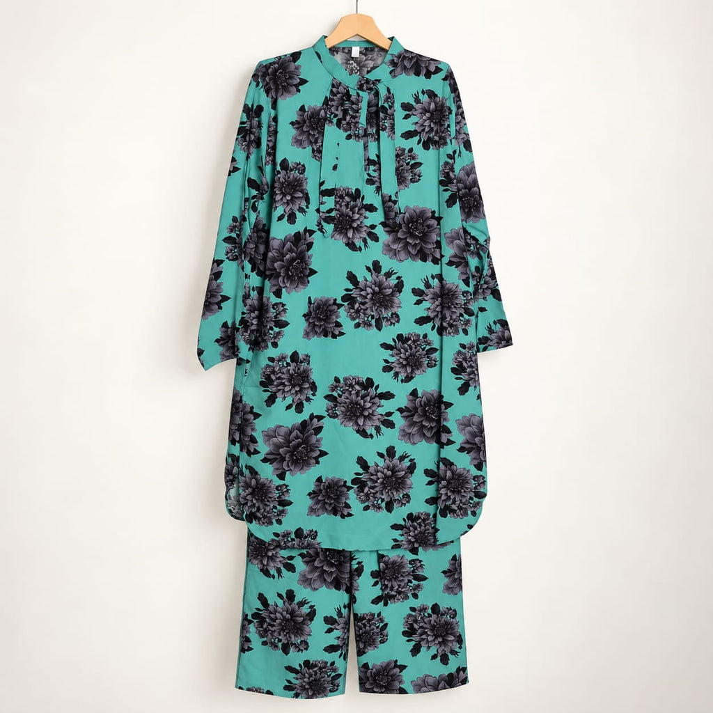 Ferozi girls’ button-front shirt with black floral print and matching trousers on a hanger