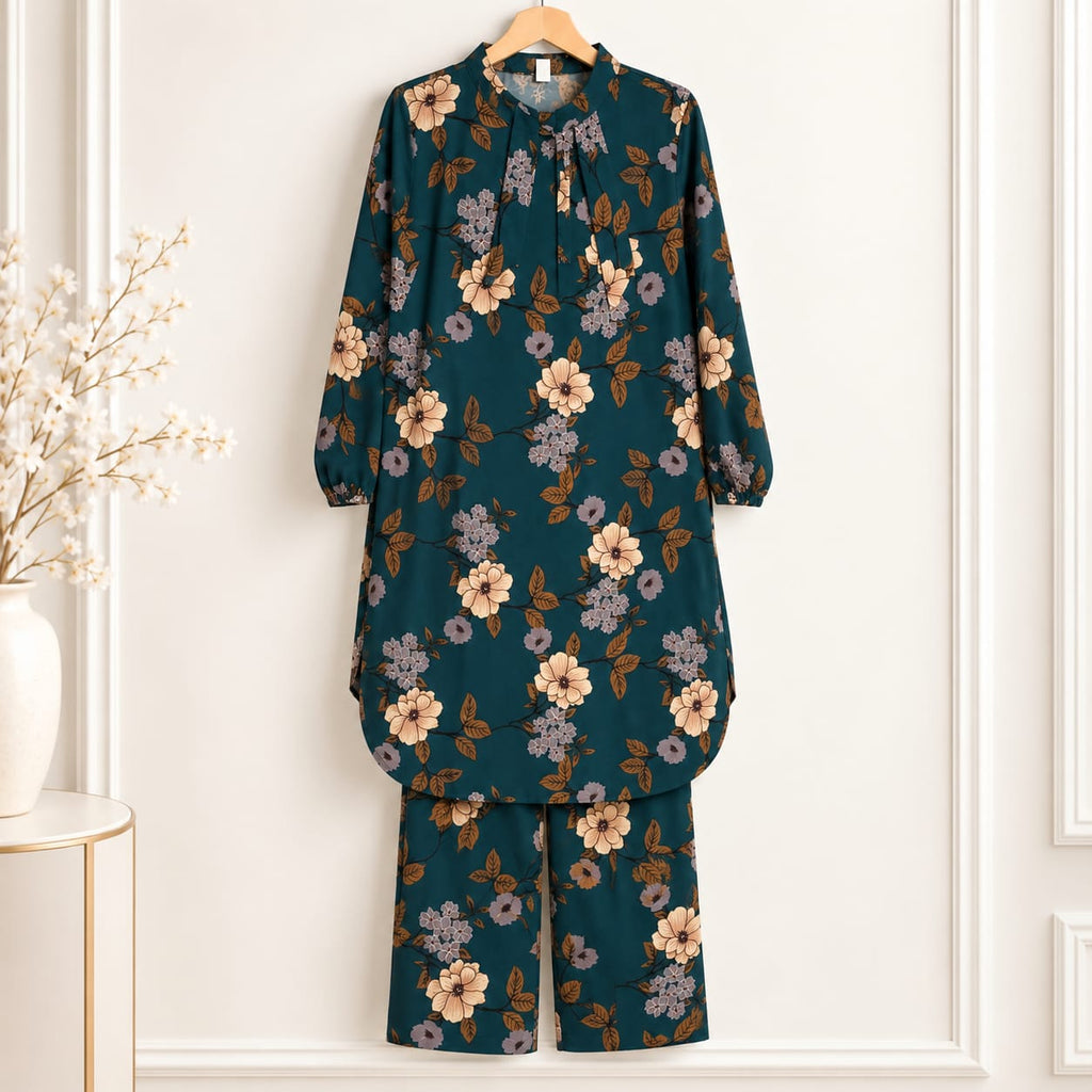 Zinc-coloured girls’ shirt with tan floral print and matching trousers on a hanger