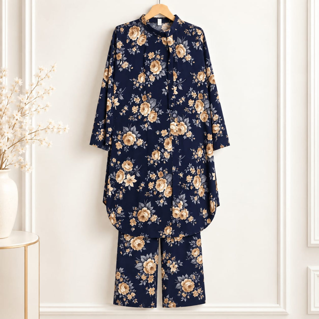 Girls’ navy blue two-piece suit with beige rose motifs on a navy blue background, a long-sleeved top and matching trousers