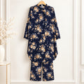 Girls’ navy blue two-piece suit with beige rose motifs on a navy blue background, a long-sleeved top and matching trousers