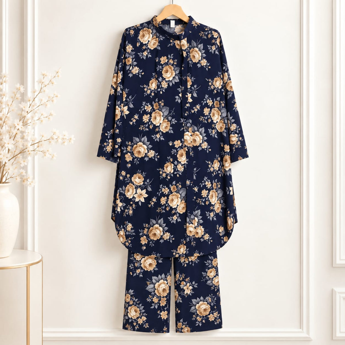 Girls’ navy blue two-piece suit with beige rose motifs on a navy blue background, a long-sleeved top and matching trousers
